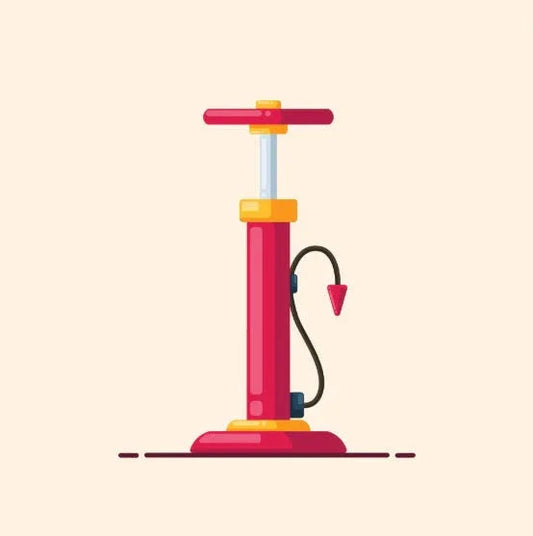 Red and yellow hand pump with hose and nozzle on light background, inflatable air pump tool