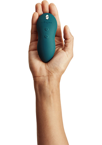 Teal handvibrator met knoppen aan de bovenkant, ovale behuizing