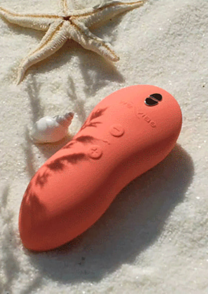 Oranje handvibrator met ovale, afgeronde vorm