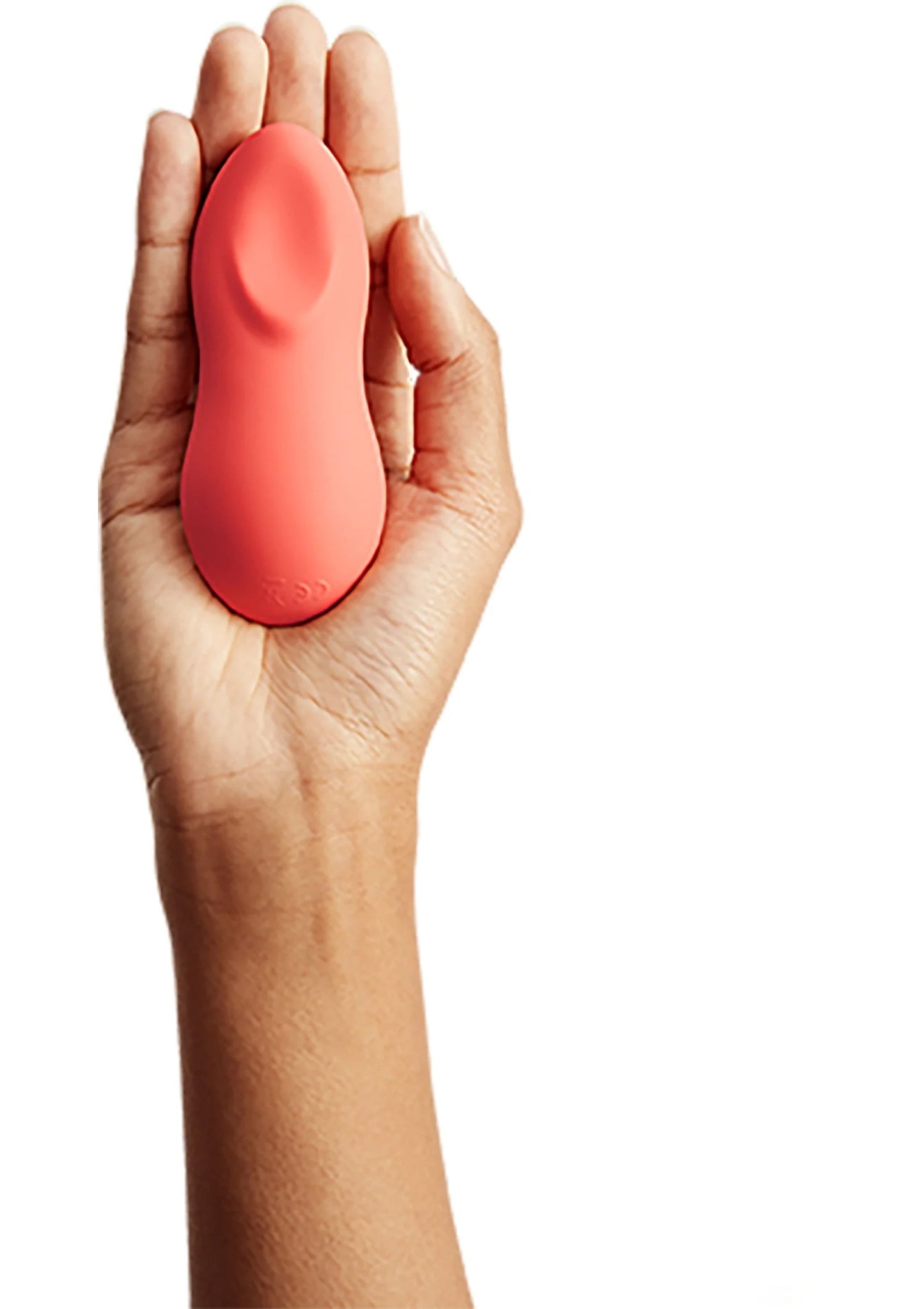 Oranje ovale vibrator in hand, glad en afgerond