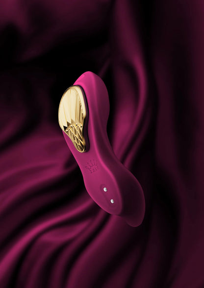 Draagbare vibrator, paarse kop met gouden inzet en ronde bedieningsknopjes