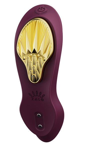Paarse draagbare vibrator met gouden opzet en twee knoppen onderaan