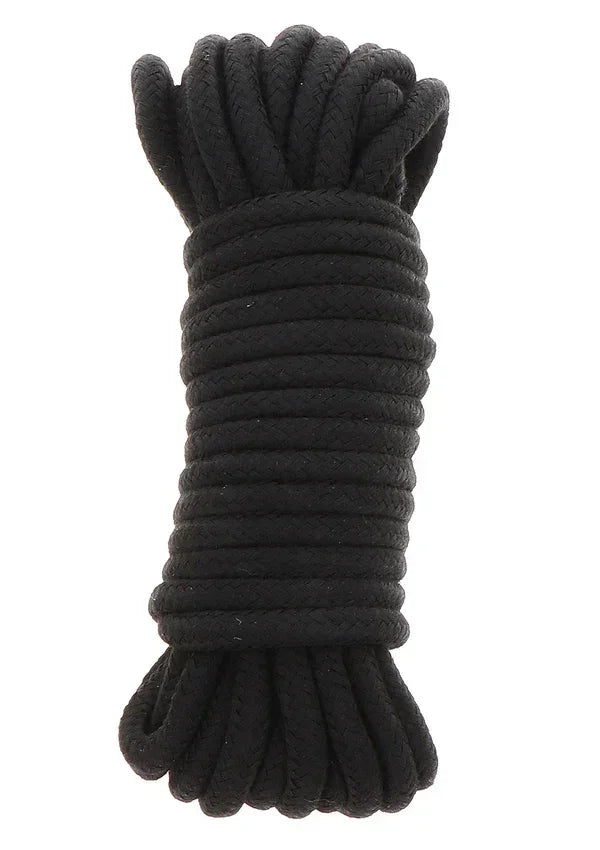 Zwarte bondage-koordbundel met opgerolde strengen en geknoopte uiteinden.