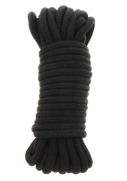 Zwarte bondage-koordbundel met opgerolde strengen en geknoopte uiteinden.