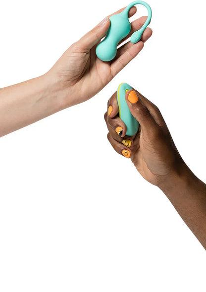 Teal G-spot tipvibrator vastgehouden; oranje en gele onderdelen zichtbaar